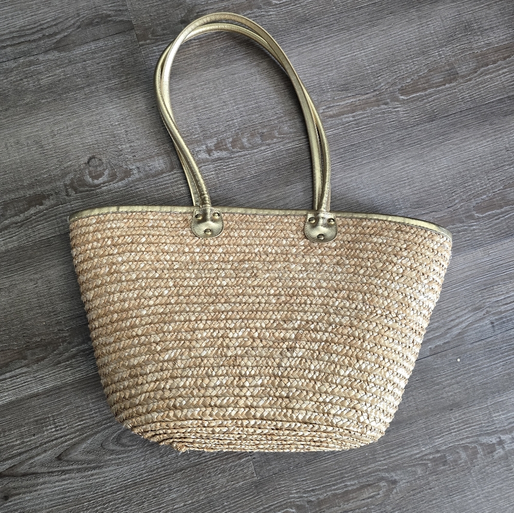 White stag woven straw tote bag with gold handles. In excellent condition.
